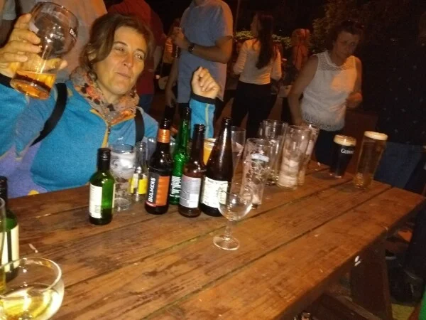 Customers enjoying drinks outdoors at Conway's Corner House on a busy evening