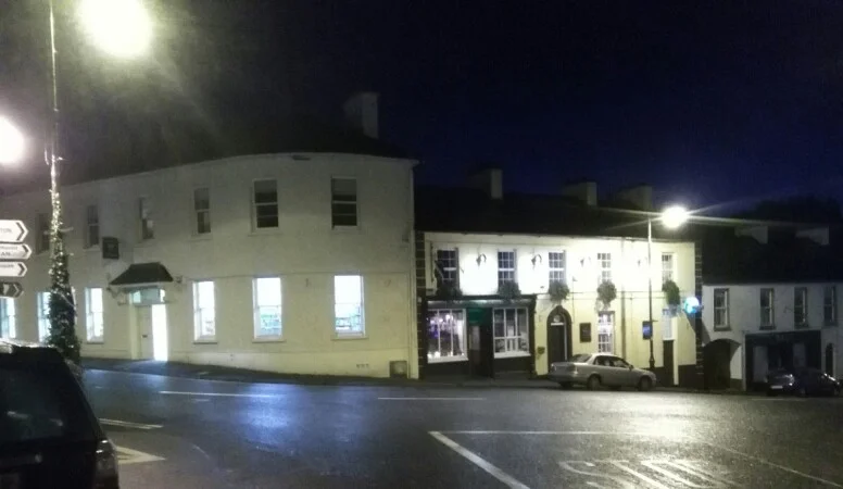 Conway's Corner House lit up at night on the corner of Drumshanbo's Main Street